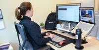 Computer monitor is too far away from the sitting position.
